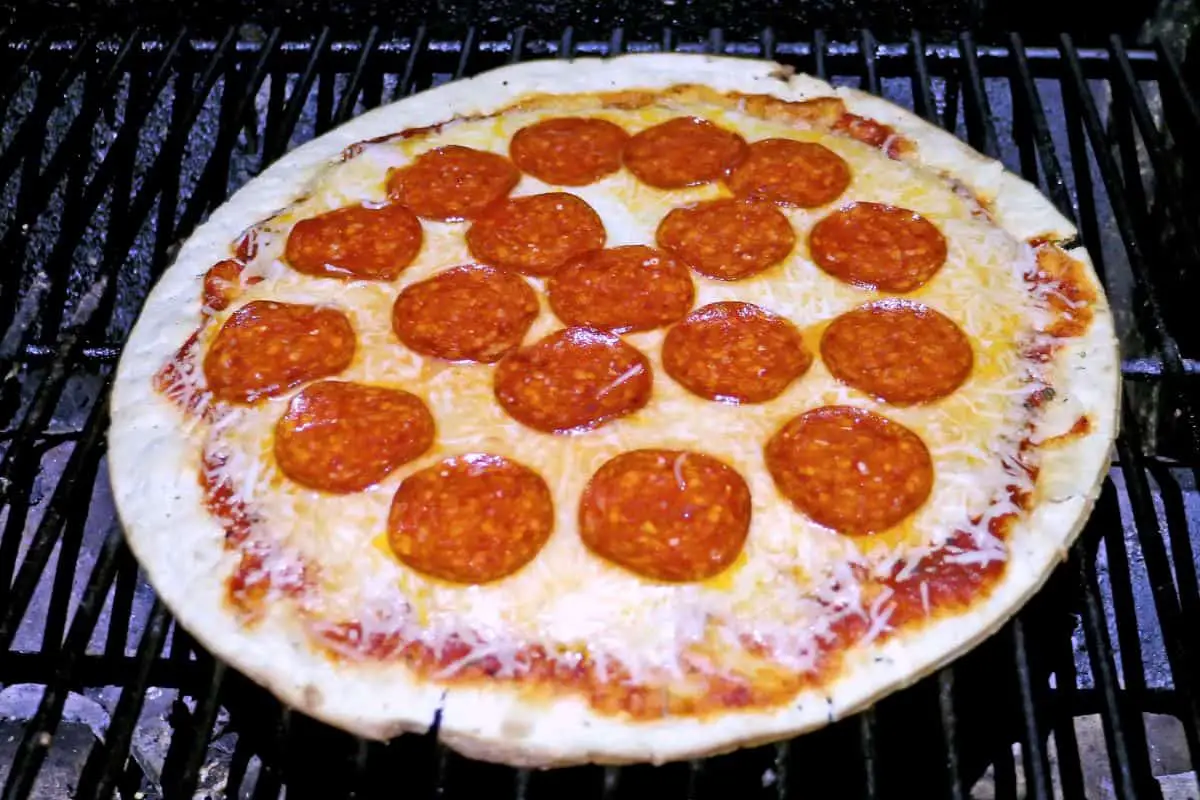 Cooking A Pizza On A Traeger Grill With A Pizza Stone