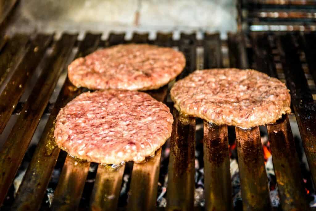 How To Cook Burgers On A Traeger [Temps, Time & More!] Master The Flames