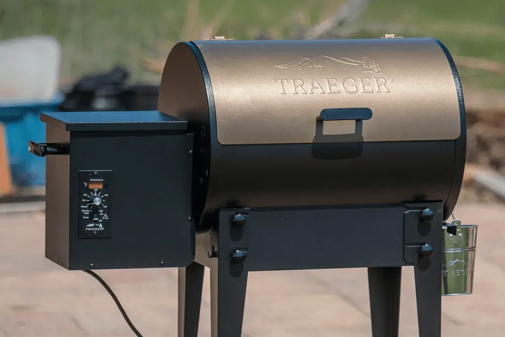 Traeger grill installed outside on a sunny deck.